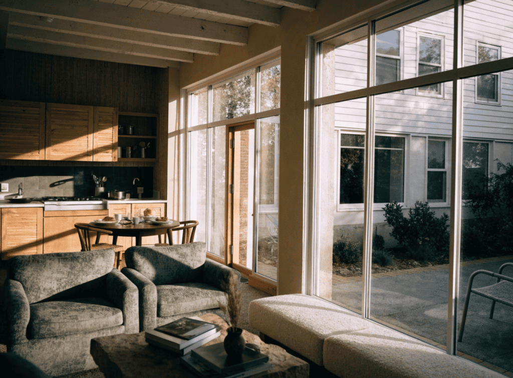 Bright Small Home - Small Homes USA Newsletter Bright living room with large windows and modern furniture.