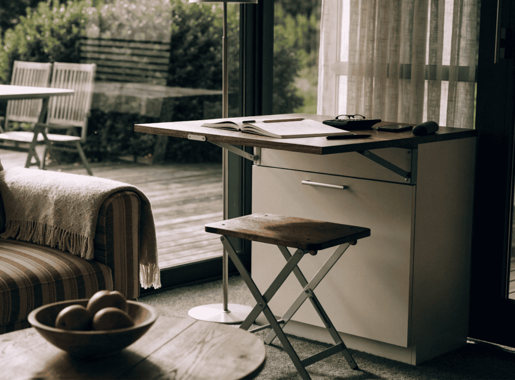 Cozy Small Home Interior with Desk - Small Homes USA Newsletter Interior view of a small home with a desk and large window.