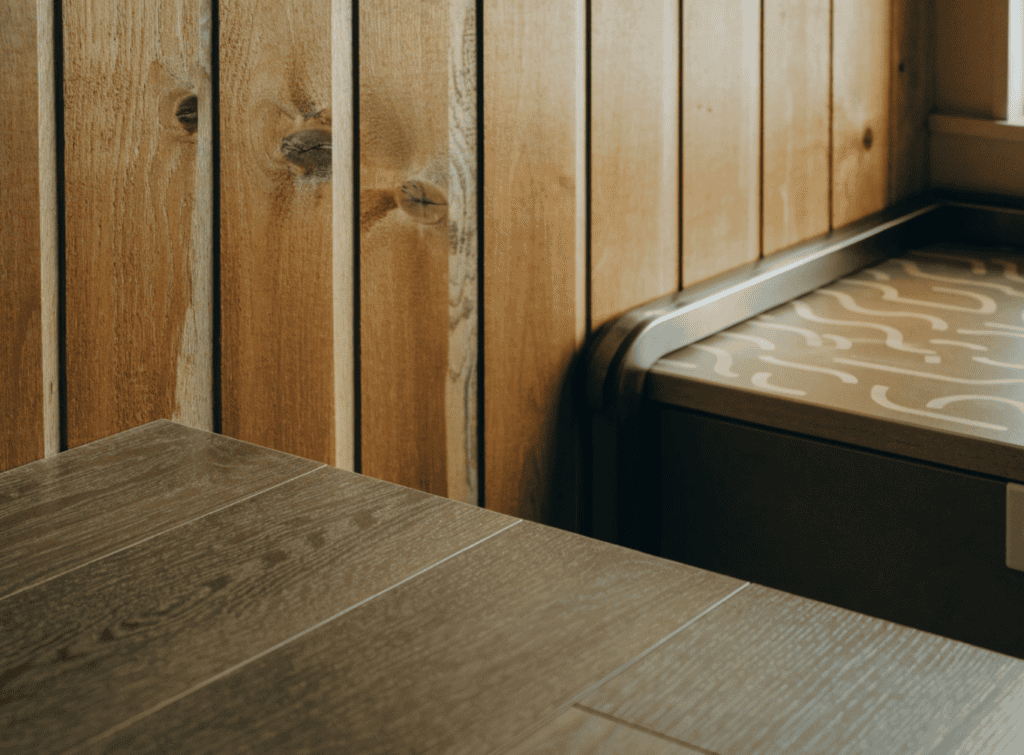 Tiny Home Interior - Small Homes USA Newsletter Close-up of wooden wall paneling and a small bed in a tiny home interior.